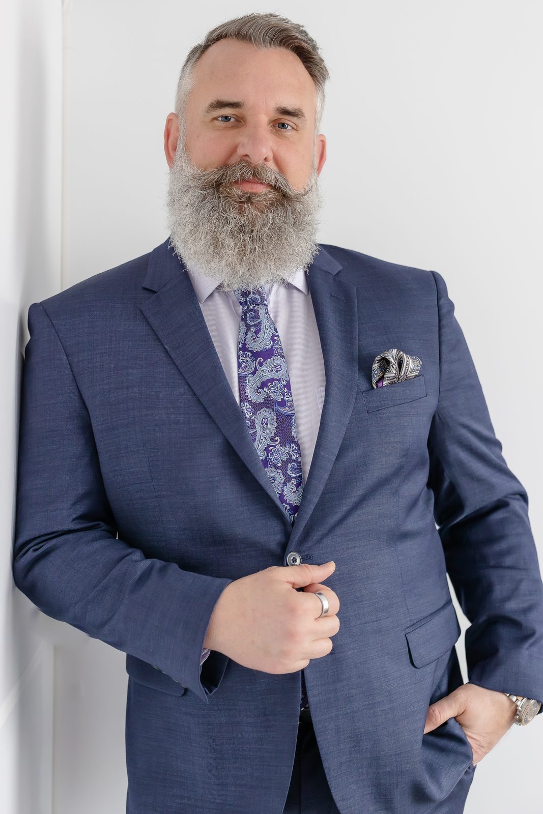 Professional portrait, navy suit and paisley tie