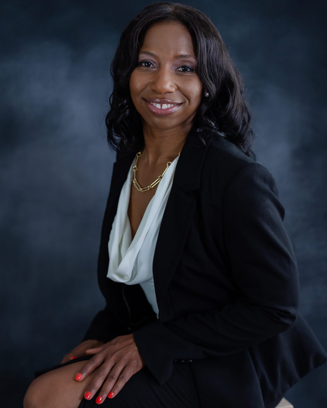 Executive portrait on dark backdrop