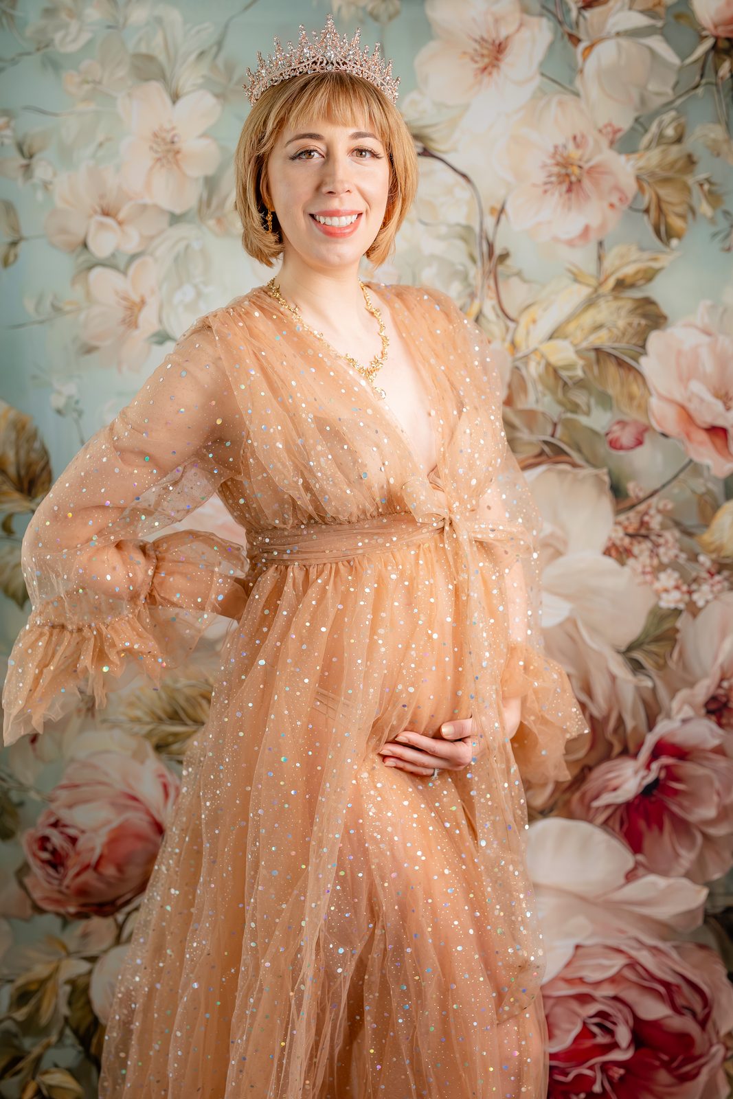 Maternity portrait with crown and peach tulle gown
